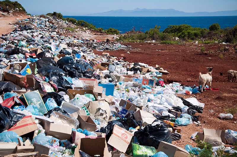 Waste dumped on land near the sea