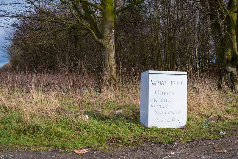 A fridge fly-tipped in the countryside
