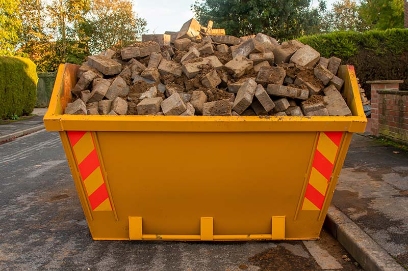 Skip placed on a road needing a skip permit