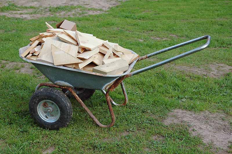 Wheelbarrow carrying construction waste