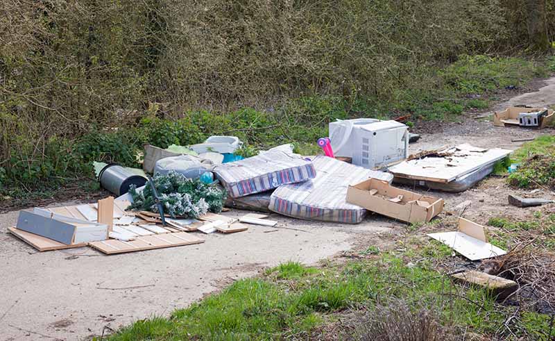 Rubbish fly-tipped on country lane