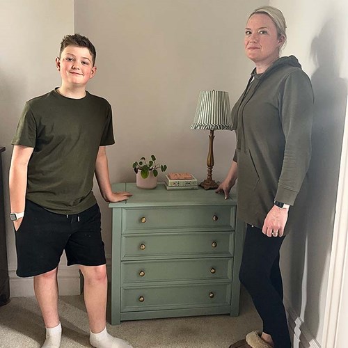 Rebecca Lewis with her son showing flatpack furniture they built for a DIY Legacy