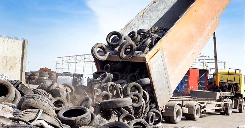 Tyre waste being disposed of at a waste transfer station