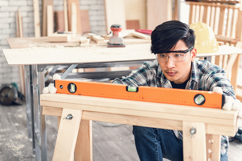 Wear the right clothing and PPE protection - Man wearing safty glasses