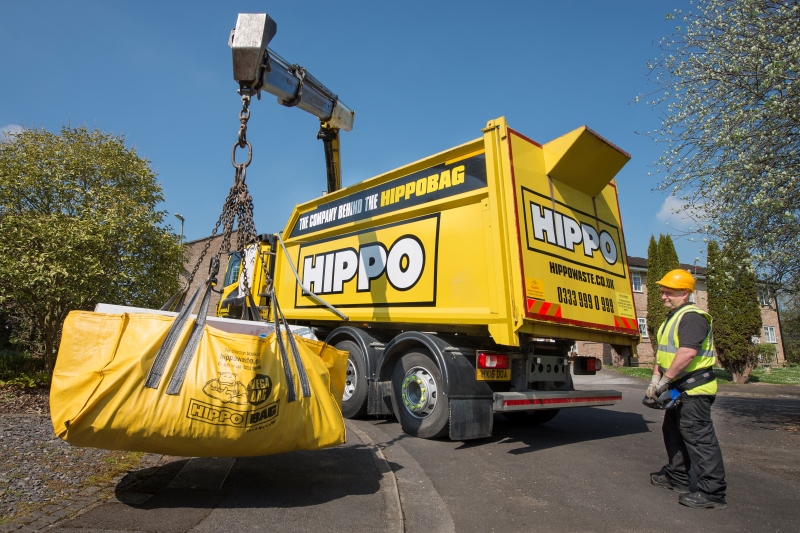 HIPPOBAG being lifted by crane on vehicle for collection