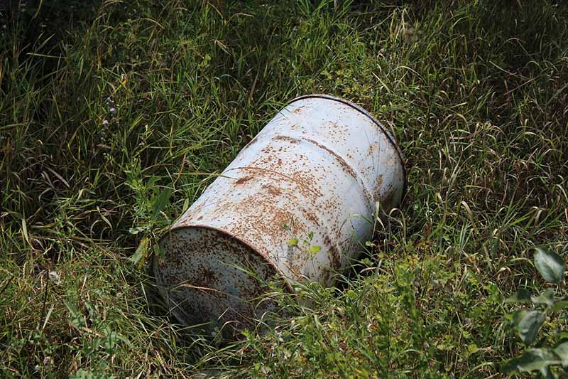 Metal oil drum barrel incorrectly fly tipped