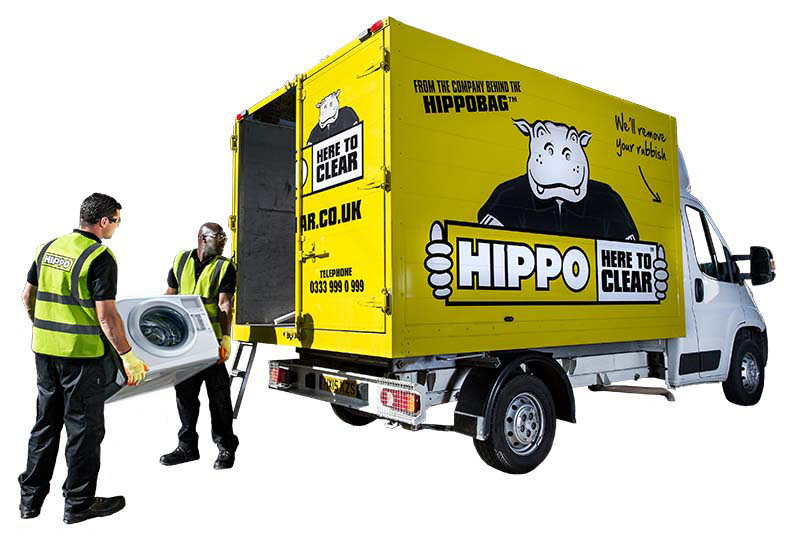 HIPPO Man and Van team loading a washing machine into a van