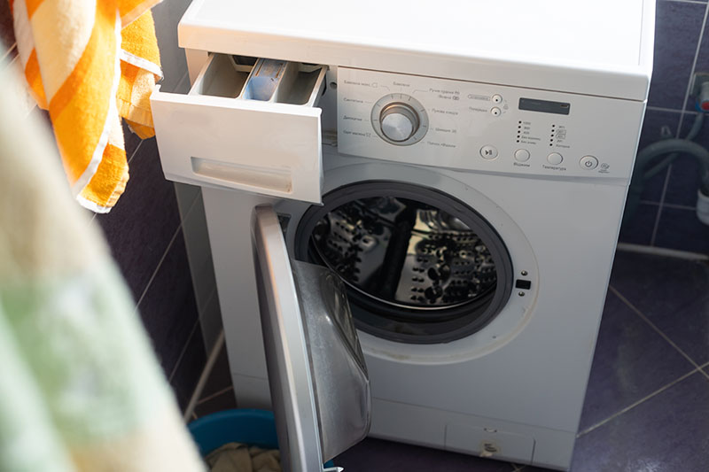 Washing machine with drawer and door open