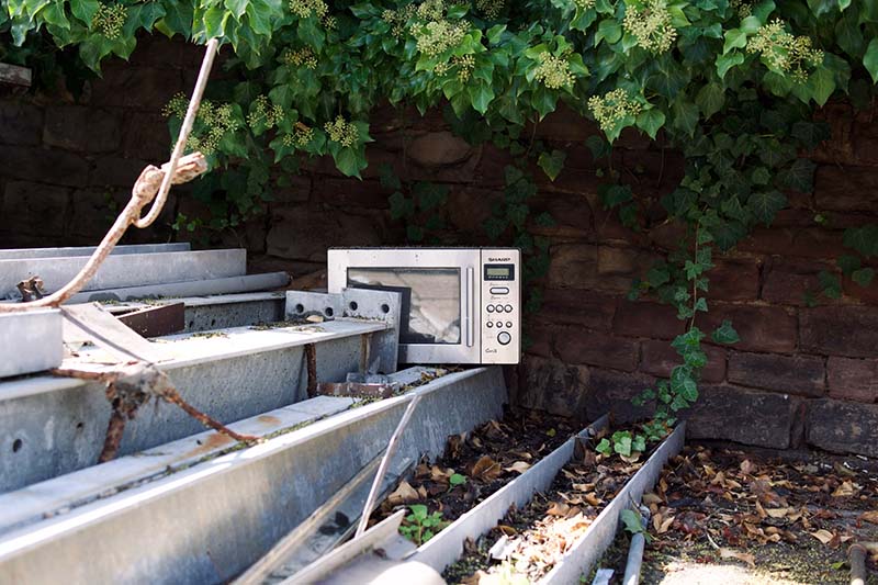 Old microwave dumped outside